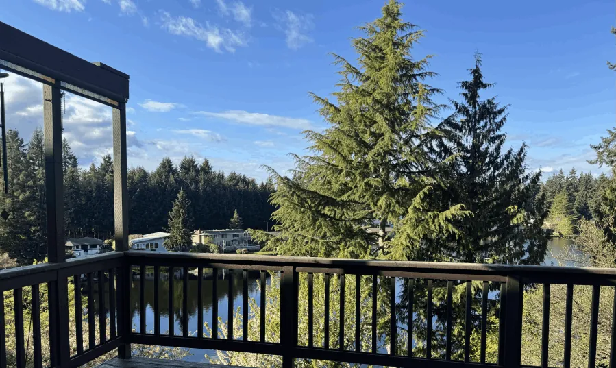 Deck at the Lakeside Retreat looking out over Twin Lakes through the firs