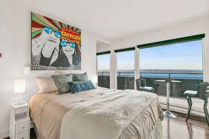 OceanView condo bedroom with pop art and Elliott Bay water views