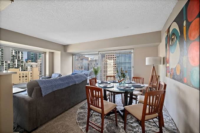 Pike Place Condo dining area with downtown Seattle skyline views